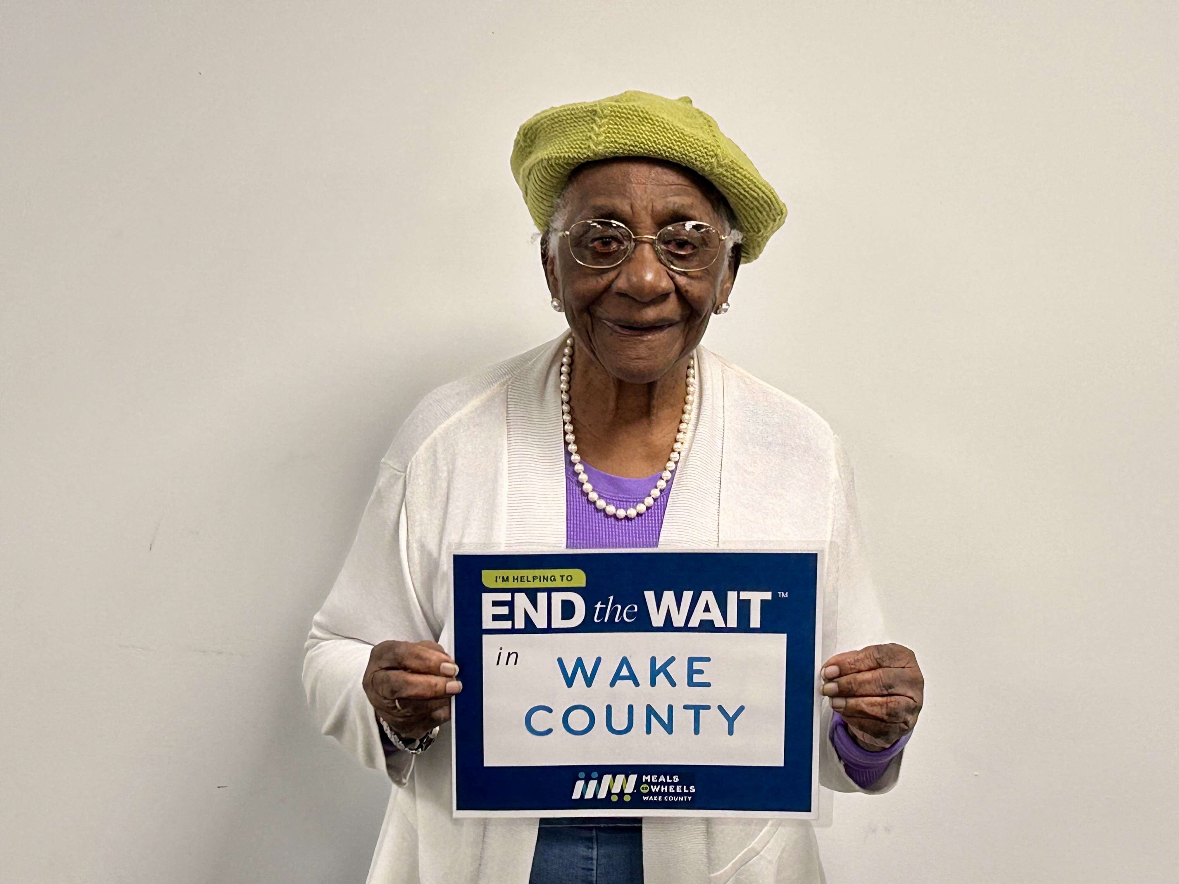 Meet Mrs. Alice, who celebrated her 96th birthday in February. A member of the White Oak Friendship Cafe for three years, she grew up in the Green Level community and has witnessed its transformation from farmland to suburban neighborhoods. Although she can no longer cook, she appreciates the meals provided and values the social connections she makes, sharing her life experiences, including overcoming struggles during the Civil Rights movement. She strives each day to make her community better.