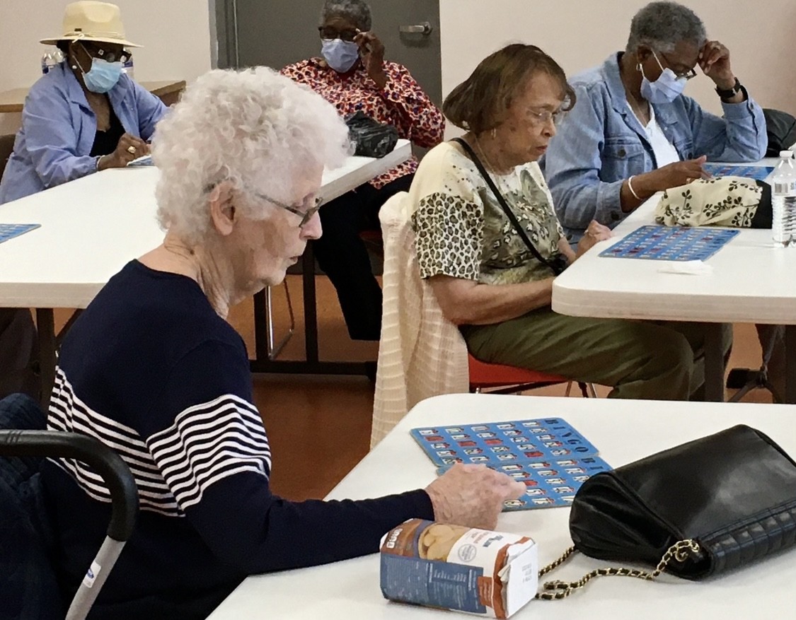 Wake Forest Friendship Cafe clients enjoy a game of bingo before lunch.